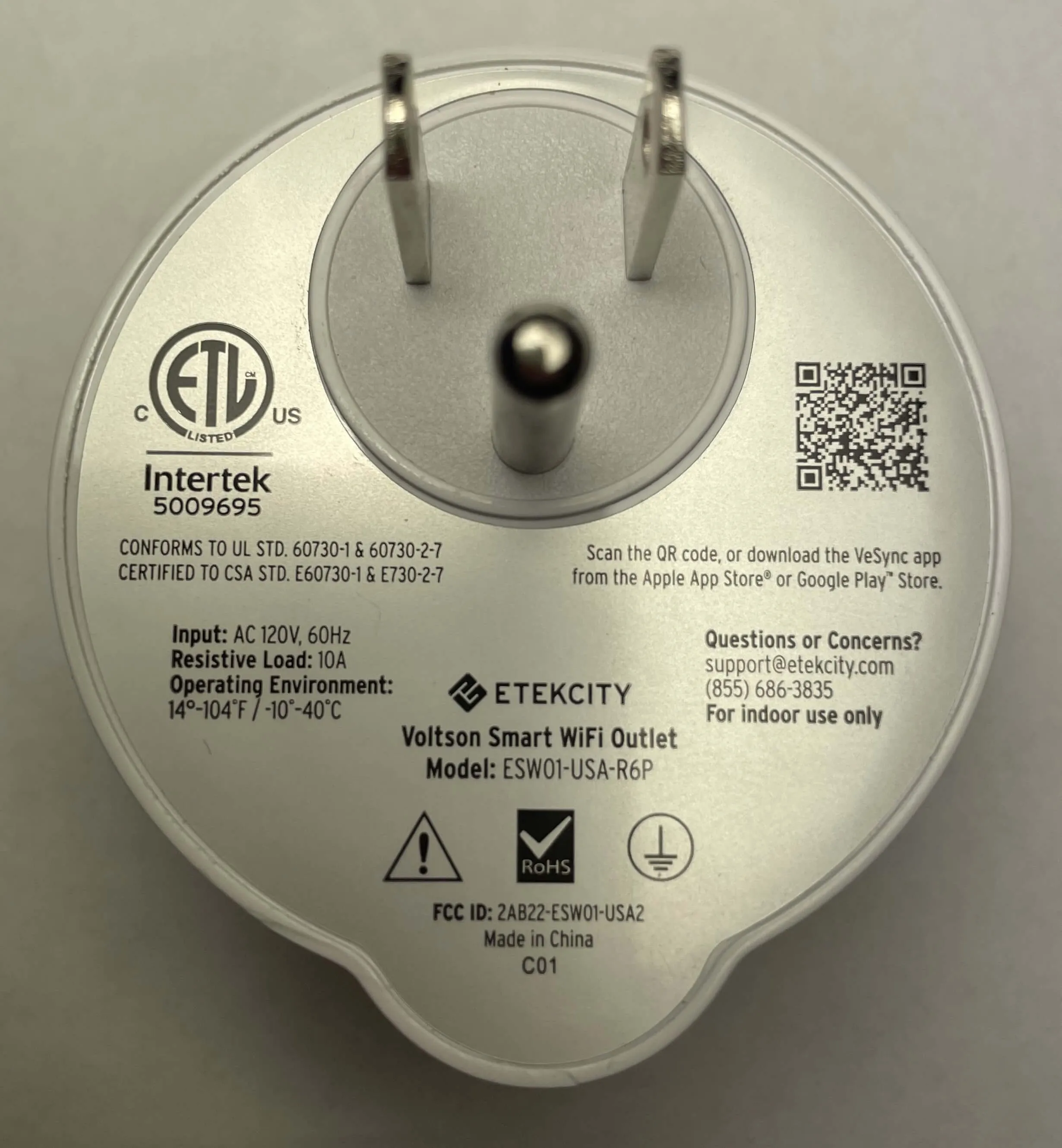 A back view of the Etekcity Voltson ESW01-USA-R6P Smart Outlet, displaying the sticker with all its product details.